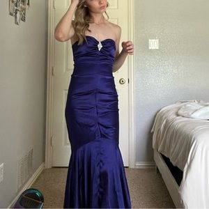 Purple Strapless XScape prom dress from Camille La Vie